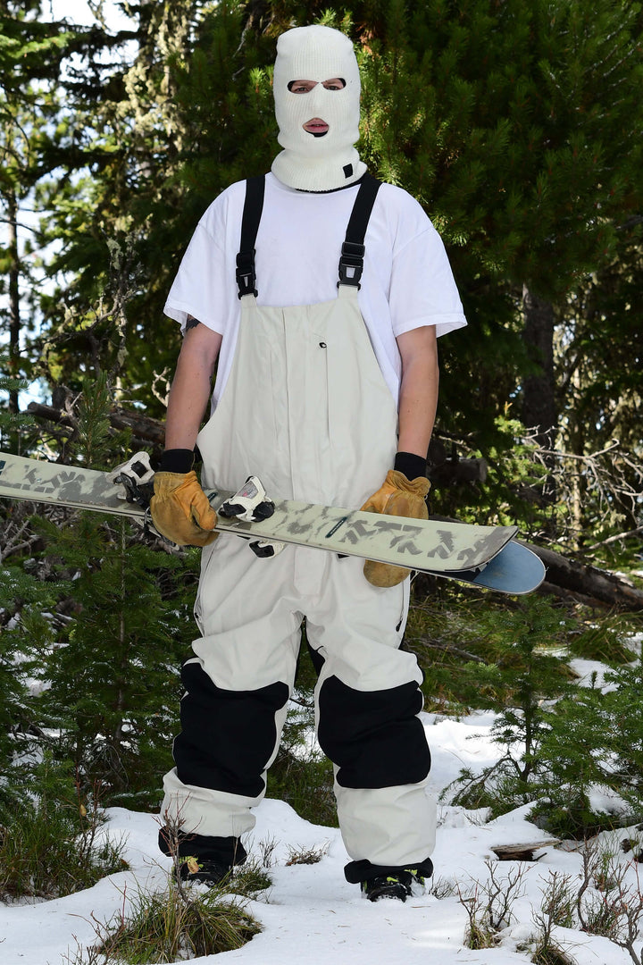Witte sneeuwbroek voor heren met ritssluiting aan de voorkant en klittenbandsluiting