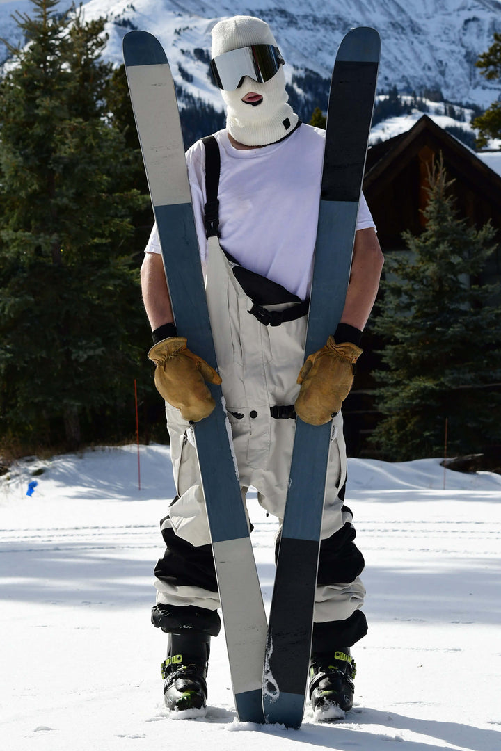 Witte sneeuwbroek voor heren met ritssluiting aan de voorkant en klittenbandsluiting