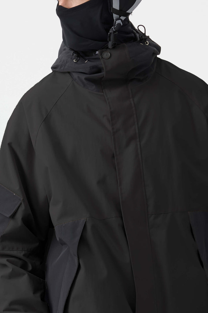 Dunkelgrüne Schneejacke für Herren mit Raglanärmeln und Farbblockdesign, wasserdicht und atmungsaktiv