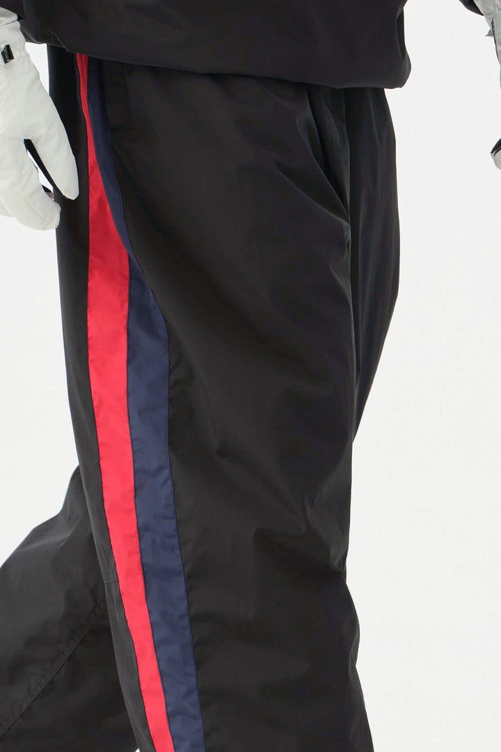 Heren zwarte en rode 90s retro track colorblock baggy sneeuwbroek