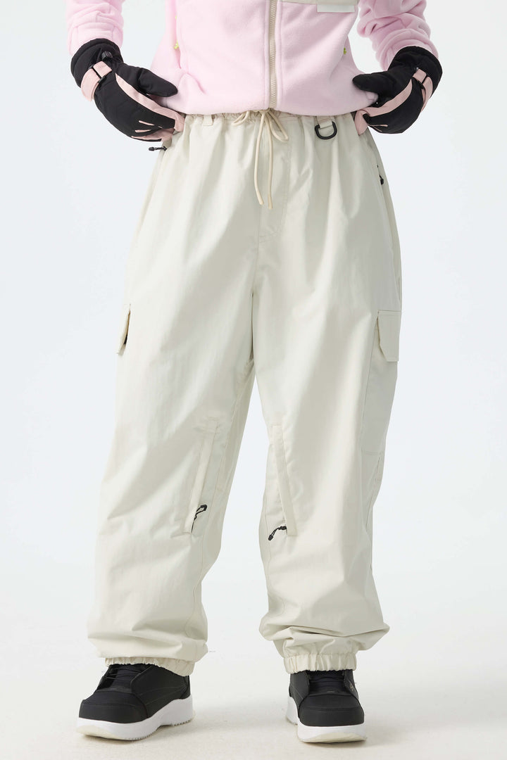 Calça de neve feminina preta, elegante, esportiva, utilitária, com bolsos cargo ocultos e modelagem folgada.