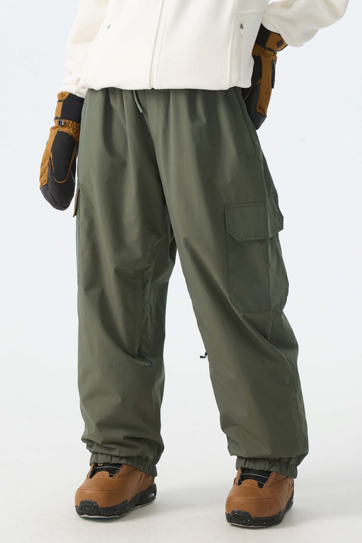 Calça de neve feminina preta, elegante, esportiva, utilitária, com bolsos cargo ocultos e modelagem folgada.