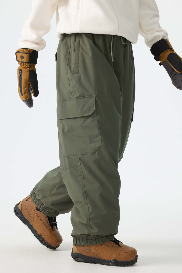 Calça de neve feminina preta, elegante, esportiva, utilitária, com bolsos cargo ocultos e modelagem folgada.