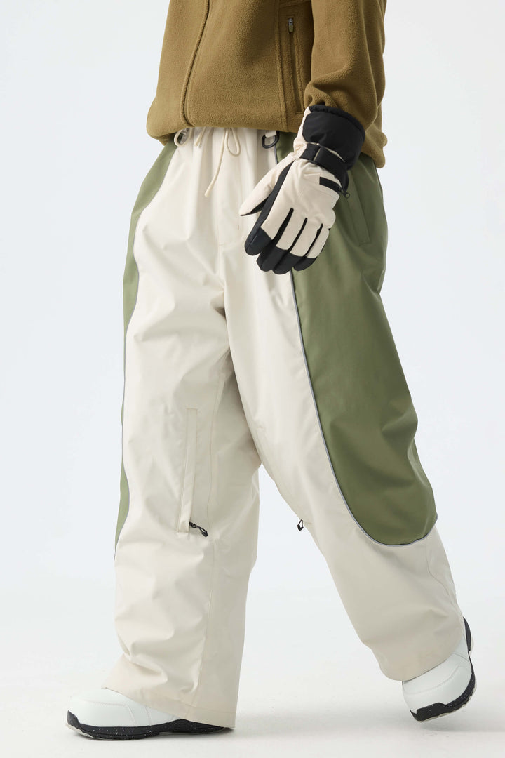 Calça de neve feminina preta, larga e com detalhes refletivos.