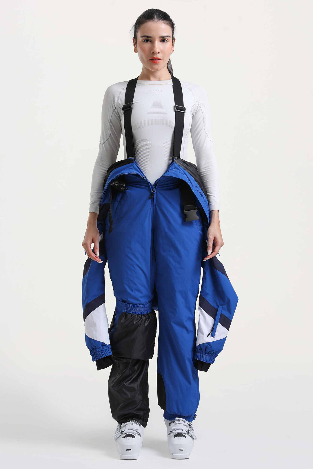 Blauer isolierter, einteiliger Skianzug im Color-Block-Design für Damen mit strapazierfähigem Stoff und mehreren Taschen