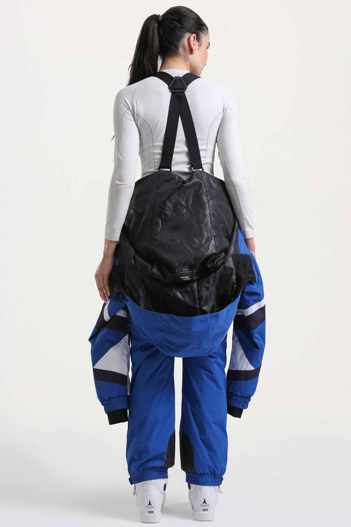 Blauer isolierter, einteiliger Skianzug im Color-Block-Design für Damen mit strapazierfähigem Stoff und mehreren Taschen